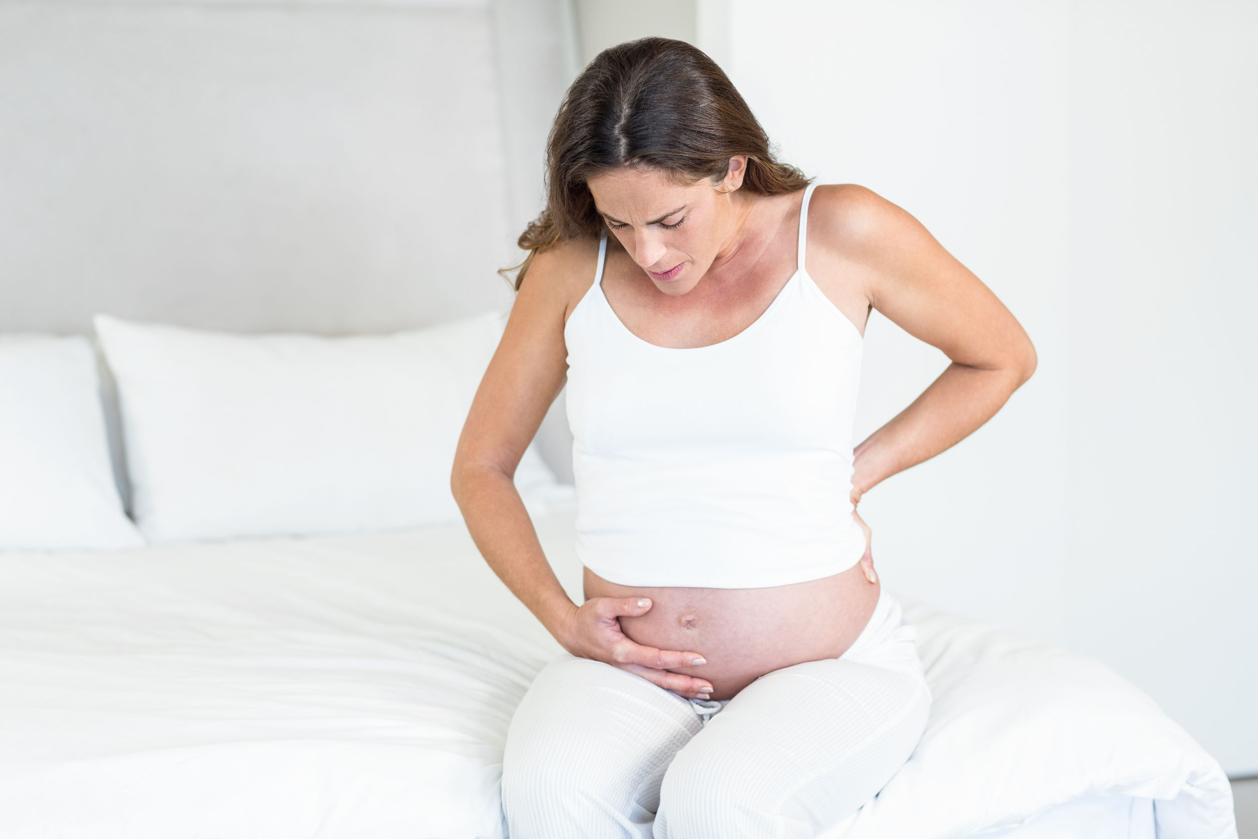 Болит живот как перед месячными при беременности